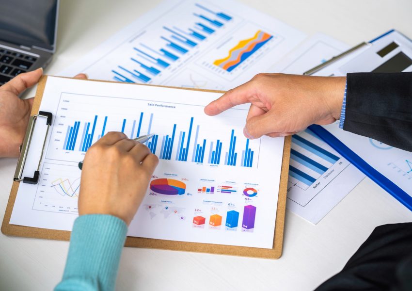 business-partnership-coworkers-using-a-laptop-to-a-2023-11-27-05-26-24-utc