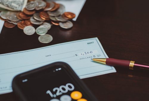 completed-check-on-a-table-with-calculator-on-smar-2024-09-18-02-29-23-utc