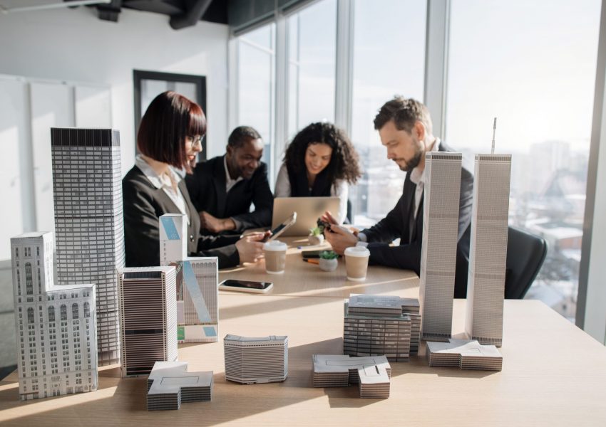 focus-on-3d-city-model-business-team-of-four-good-2023-11-27-05-00-35-utc